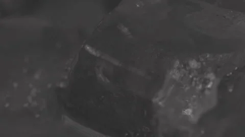 Makro Close up of Ice Cubes in Drink, rotating Stock Footage 242157517