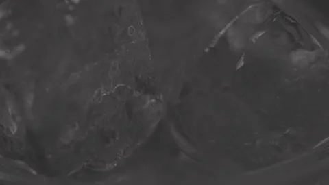 Makro of Ice Cubes in Drink, rotating Stock Footage 242157264