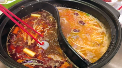 Mala soup is in a hot pot Stock Footage 290900262