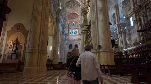 Malaga cathedral decorative interior with high ceiling, Spain - 4K tilt up Stock Footage 311289152