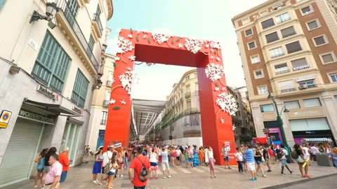 Malaga, Spain. Circa August 2018. Young people taking pictures in the gate of Video stock 102802306