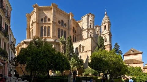 Malaga, Spain. Circa May 2018. People walking on a sunny day. Cathedral in the Video stock 89812375