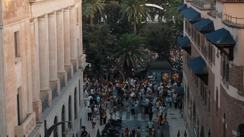 MALAGA, SPAIN - SEPTEMBER 2, 2026: People gather on a European-style street.. Stock Footage 344584268