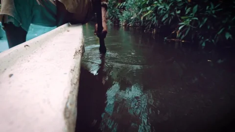 Malagasy Man Rowing Canoe 01 Stock Footage 80657137