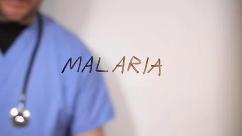 Malaria hand written on a clear screen by a doctor Stock Footage 78991379