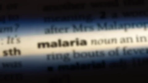Malaria word in a dictionary. Stock Footage 99563277