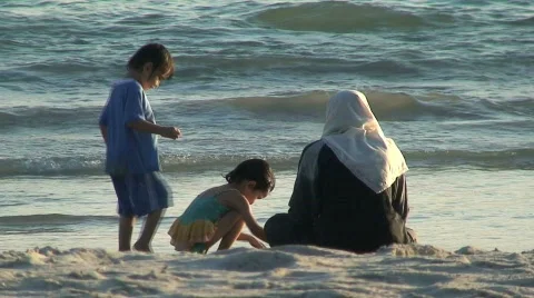 Malasian family on the beach Stock Footage