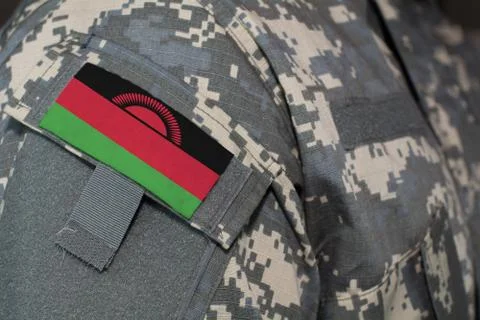 Malawi army uniform patch flag on soldiers arm. Military Concept Stock Photos