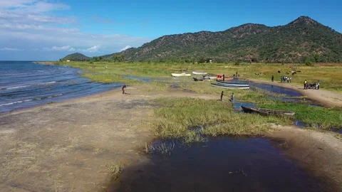 Malawi - Drone - Lake Malawi - Foreshore with Fishermen boats Stock Footage 168392005