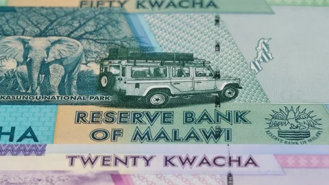 Malawi kwacha notes slow tracking. Malawian currency. Slider shot, low angle. 4K Stock Footage 126006061