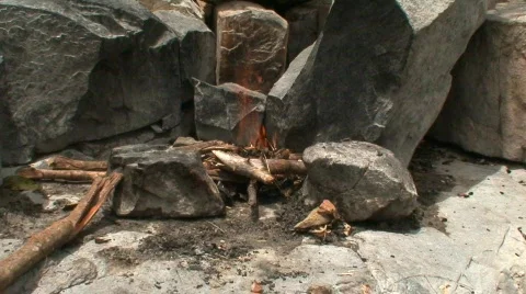 Malawi: preparing fireplace on a rock Stock Footage 362097