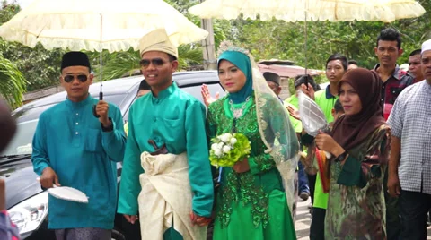 Malay Bride and Groom Walking Alongside Stock Footage 35005684