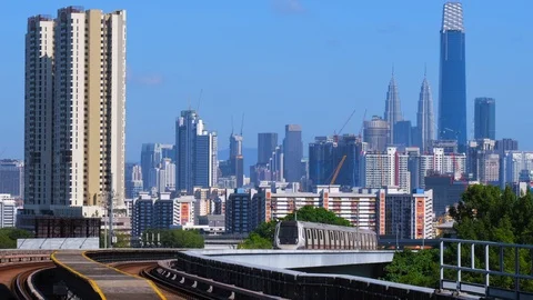Malaysia Mass Rapid Transit (MRT) train with a background of Kuala Lumpur city Stock Footage 129231305