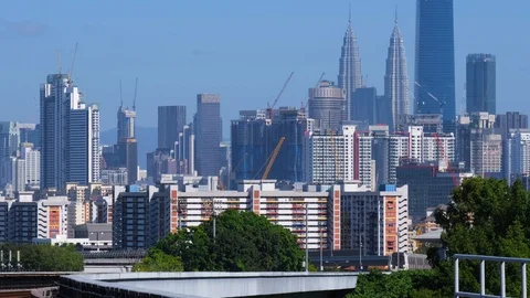 Malaysia Mass Rapid Transit (MRT) train with a background of Kuala Lumpur city Stock Footage 129238689