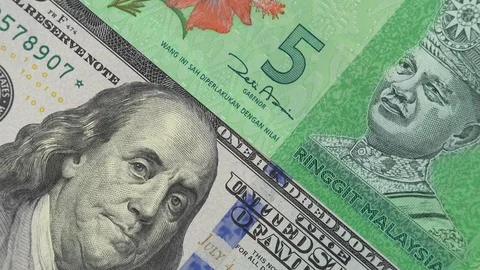 Malaysia ringgit against US dollar bill rotating. Malaysia and USA trade Stock Footage 105428250