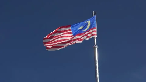 The malaysian flag is flying / waving Stock Footage 146689021