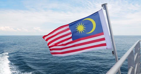 Malaysian flag waving on ferry bound to Tioman Island at day time Stock Footage 314768534