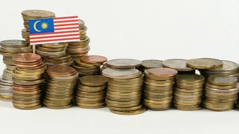 Malaysian flag waving with stack of money coins Stock Footage 71984923