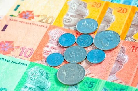 Malaysian ringgit banknotes and coins background. Financial concept. Stock Photos
