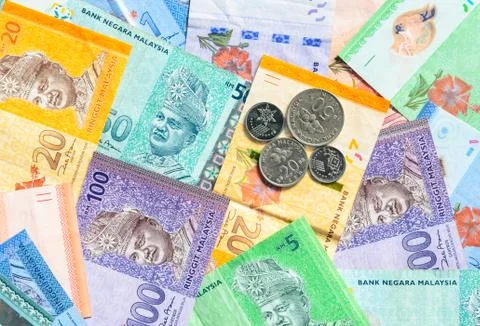 Malaysian ringgit banknotes and coins background. Financial concept. Stock Photos