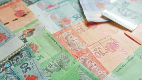 Malaysian ringgit banknotes scattered across a surface showcasing various d.. Stock Footage 293844519