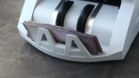 Malaysian Ringgit. Counting Malaysian money in banknote counting machine. Stock Footage 288612121
