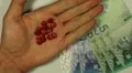 Malaysian Ringgit MYR, Counting Drugs and Money, Health Care, Colorful Pills HD Footage