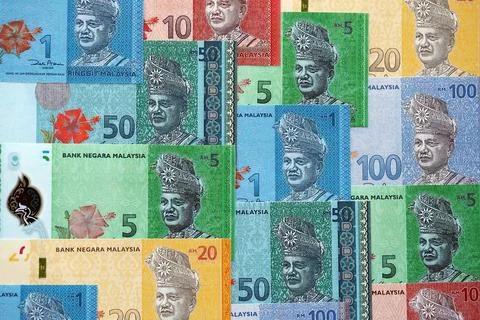 Malaysian ringgit paper banknotes pile on table. Malaysia MYR currency money Stock Photos