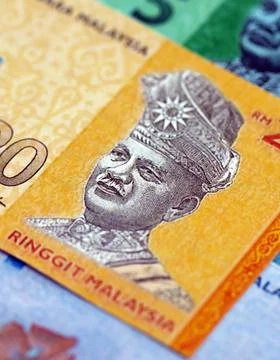 Malaysian ringgit paper banknotes pile on table. Malaysia MYR currency money Stock Photos