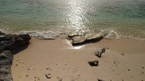 Malcolm Beach- Low Look-Down Drone Shot, Sand to Water - Turks and Caicos, 4K Stock Footage 119781444