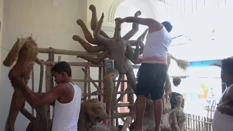 Malda, India- August 24th, 2020: A man making maa durga devi sculpture statue Stock Footage 160113724