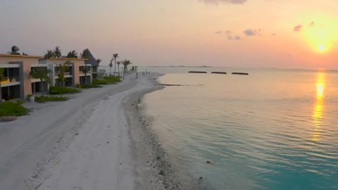 Maldives island Return flight over the island Blue ocean White sand Quiet wa Stock Footage 220627704