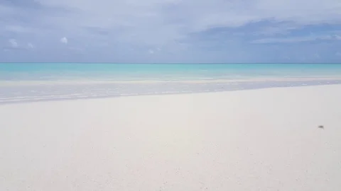 Maldives, low to the water wave lapping onto the each. Stock Footage 118053752