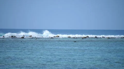 Maldives ocean waves breaking on lagoon Stock Footage 244805734