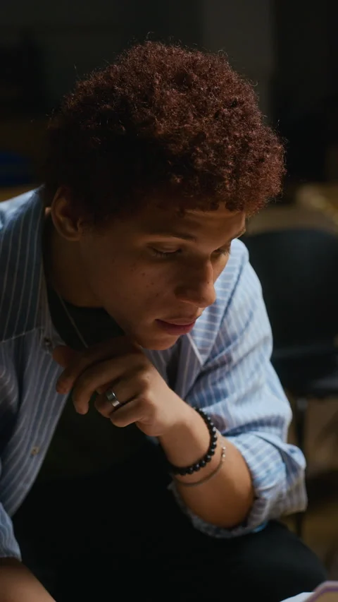 Male Actor Memorizing Lines from Script in Theater Rehearsal Stock Footage 344526238