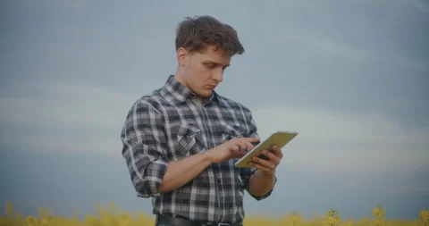 Male Agronomist Using Tablet PC In Farm. Stock Footage 246921235