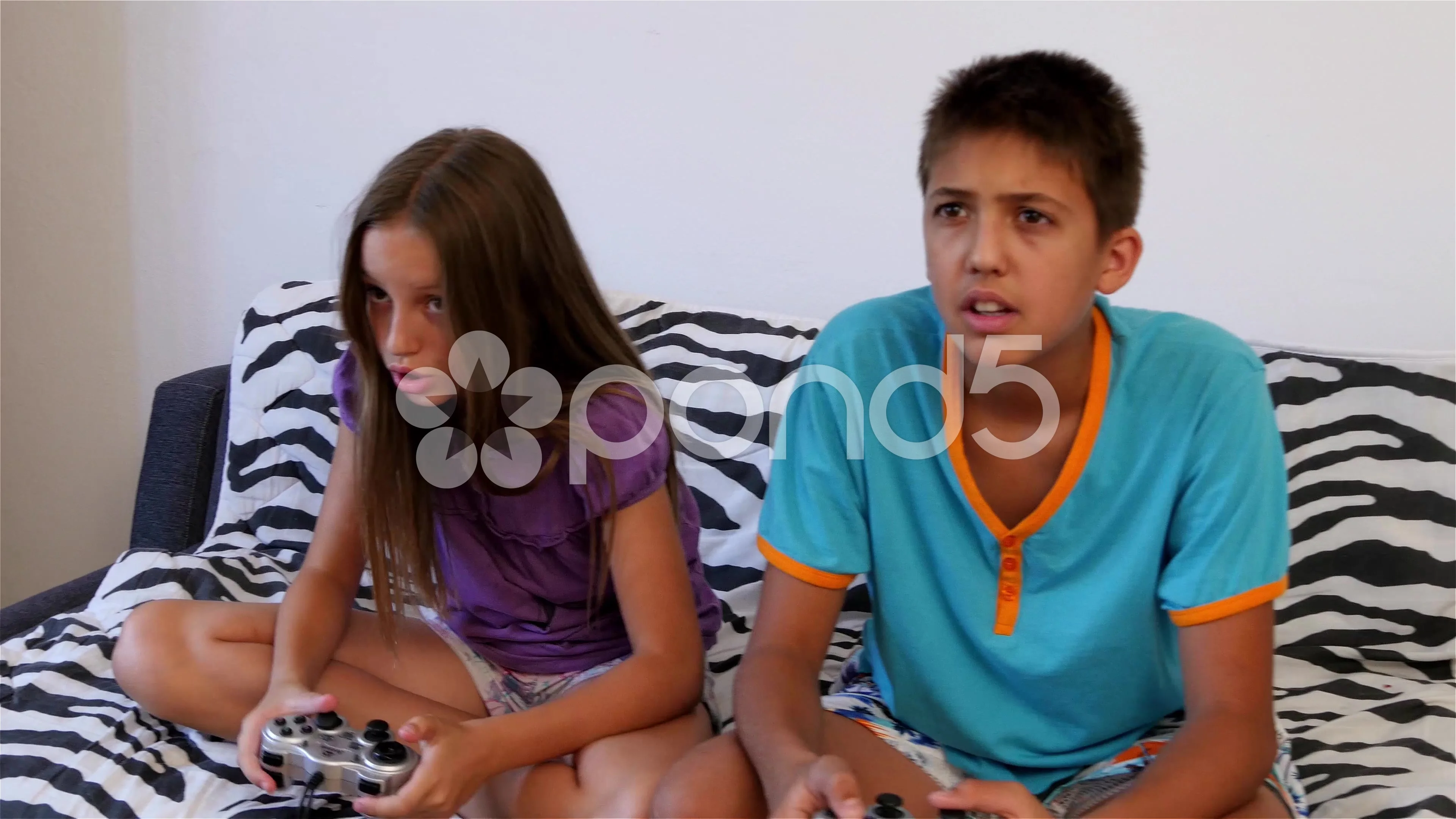 Male and female children playing video g... | Stock Video | Pond5