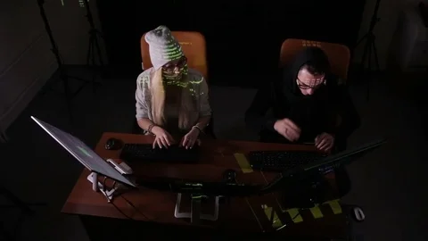 Male and female programmers making a hack. Top view shot Video stock 73654813