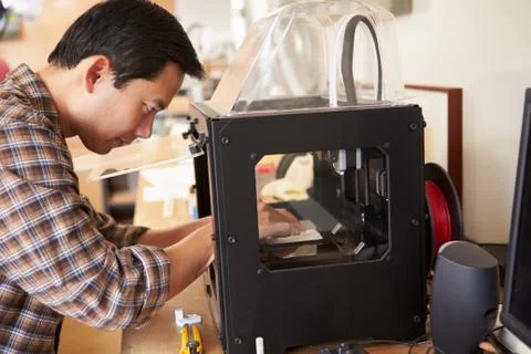 Male architect using 3d printer in office Stock Photos