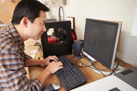 Male architect using 3d printer in office Foto stock