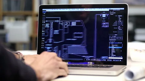 Male architect at work with a cad software on a laptop computer: teamwork Stock Footage 49775828