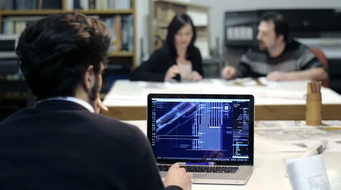Male architect at work with a cad software on a laptop computer: teamwork Stock Footage 49811139