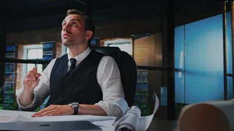 Male architect working, thinking in the office on a residential building project Stock Footage 201427050