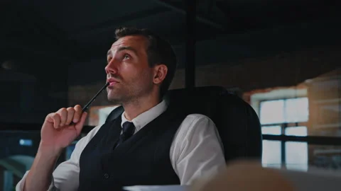 Male architect working, thinking in the office on a residential building project Stock Footage 202121581