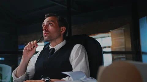 Male architect working, thinking in the office on a residential building project Stock Footage 205324200
