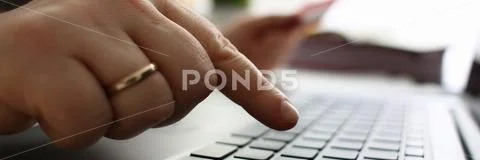 Male arms hold credit card press buttons making transfer Stock Photos