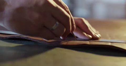 Male artisan drawing line on leather Stock Footage 172489341