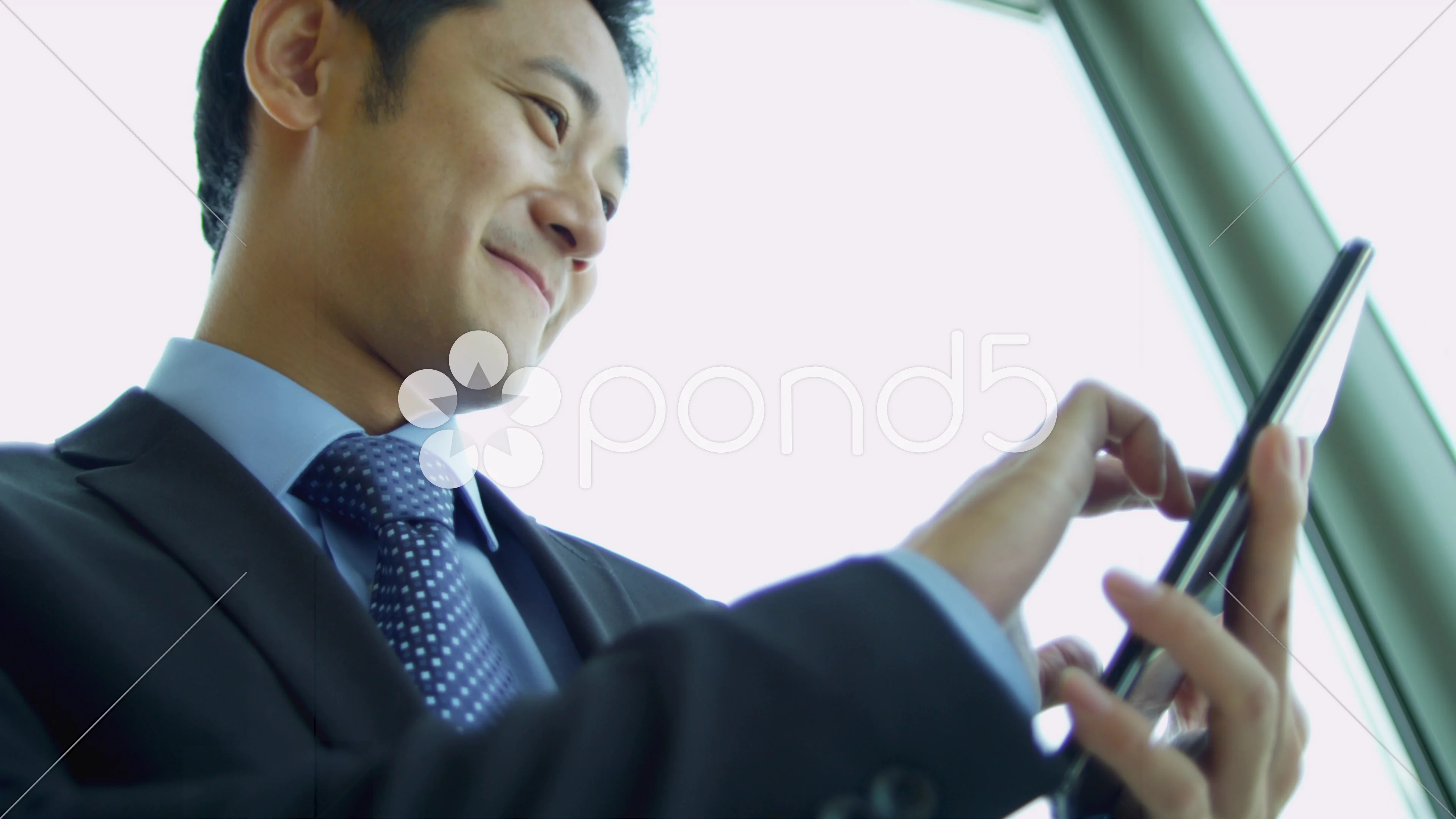 Male Asian Chinese Stock Broker Tablet Close Up