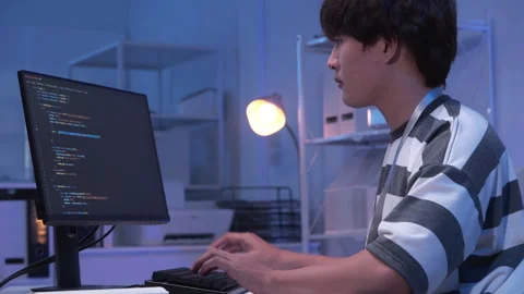 Male Asian IT freelancer programmer coding application software in room. Stock Footage 318953918
