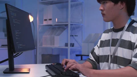 Male Asian IT freelancer programmer coding application software in room. Stock Footage 320092956